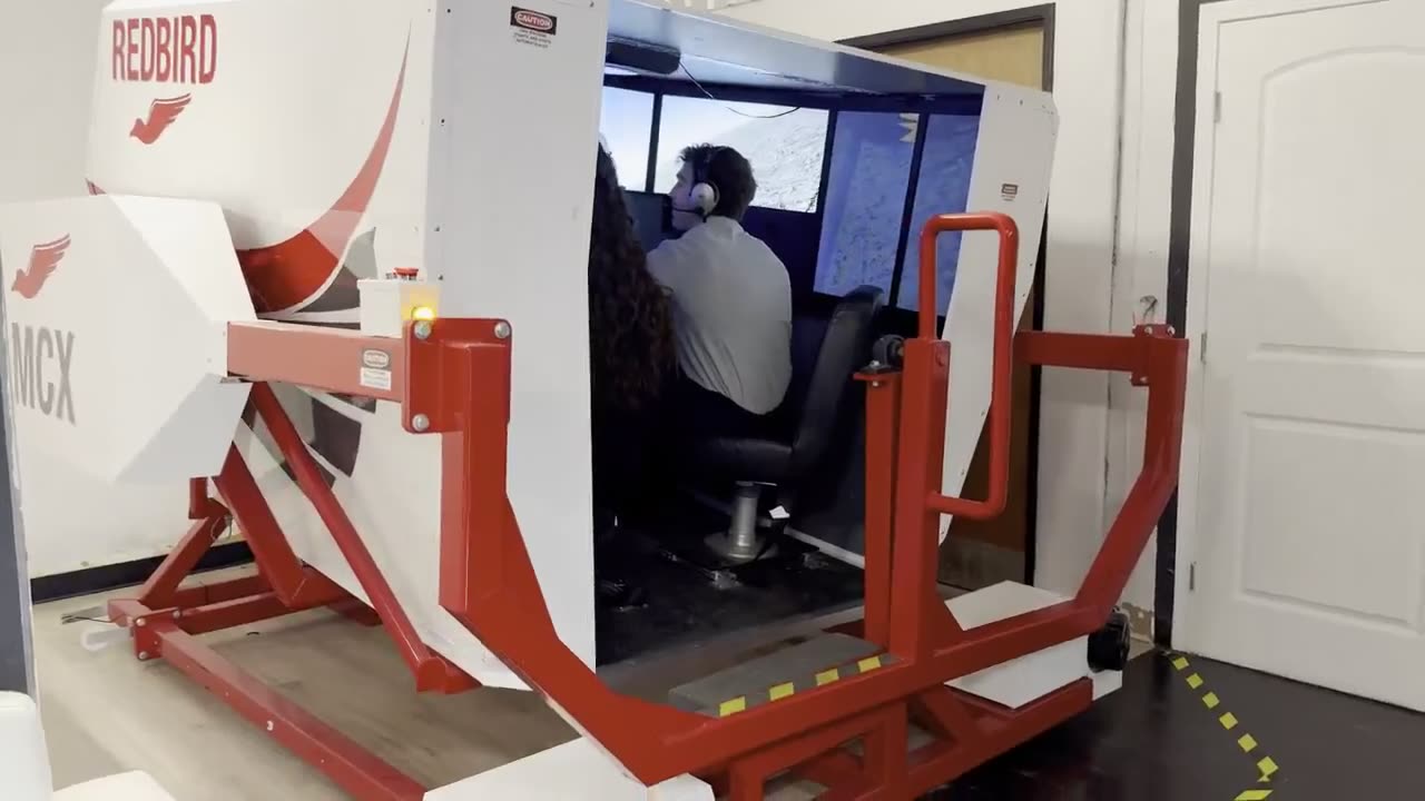 Teens train on the FAA-approved Redbird MCX full-motion simulator